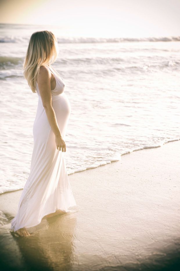 Side Boob Nipple Pregnant Woman in White Dress on the Beach