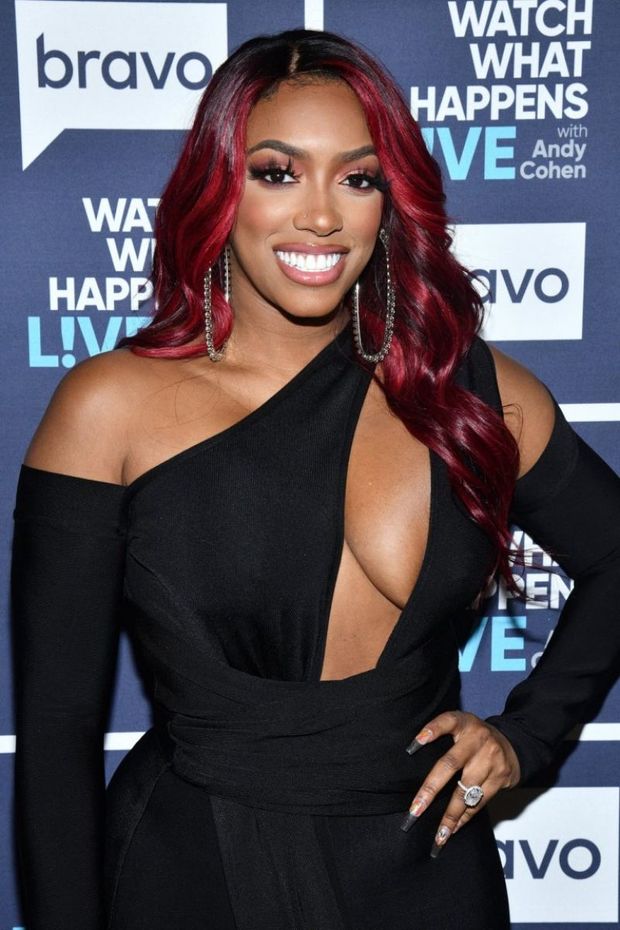 Porsha Williams braless boobs in a revealing black dress showing off her big tits cleavage.
