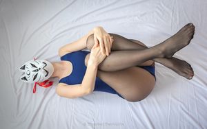 Masked in swimsuit and pantyhose