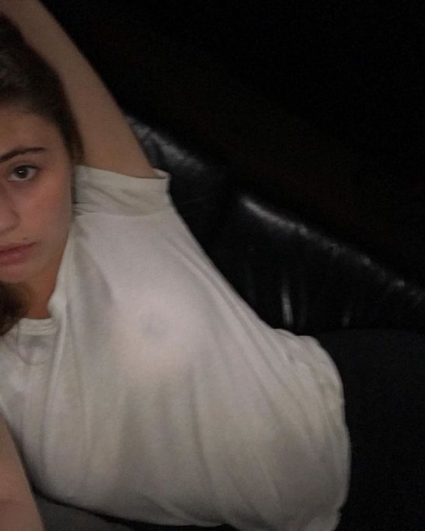 Lia Marie Johnson braless boobs in a see through white top showing off her tits.