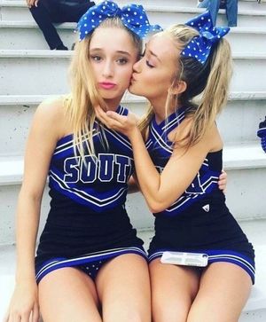 two cheerleaders having a break