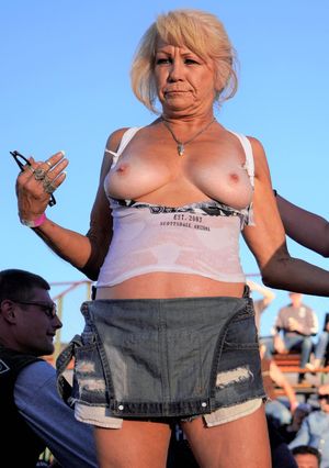 Mature Blonde Slut Exposes Tits in Public