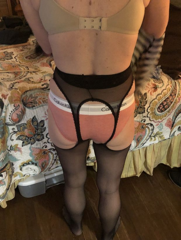 Wife's tight ass in CK panties and garter before we went to a party. Thought about this all night.