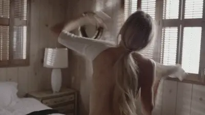 Natural blonde getting dressed