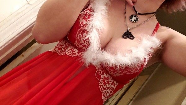 Red nightie with fluffy white trim on some big boobs.