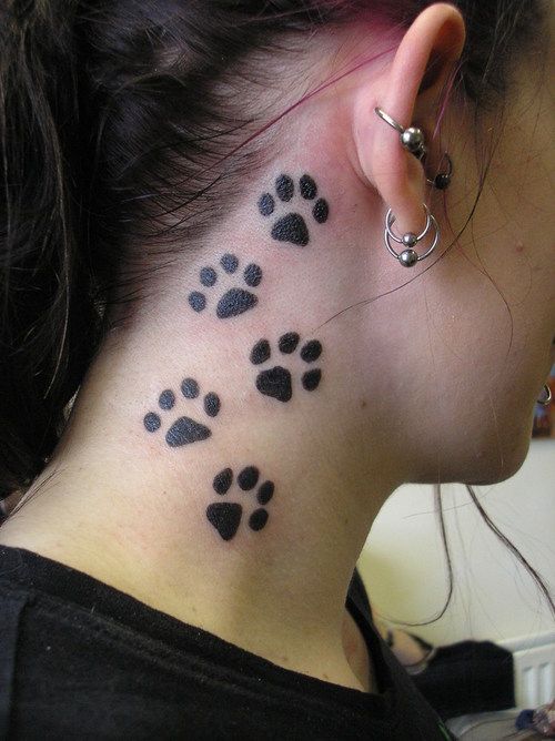 Brunette with kinky paw tattoos