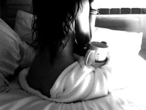 Sexy Long Haired Woman Holding A Cup of Coffee