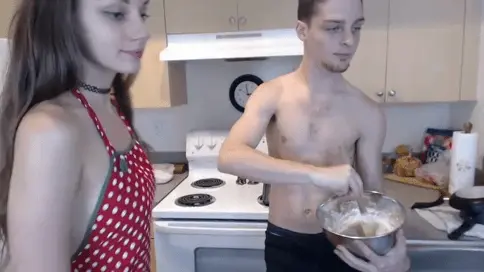 Y0ung couple cook together