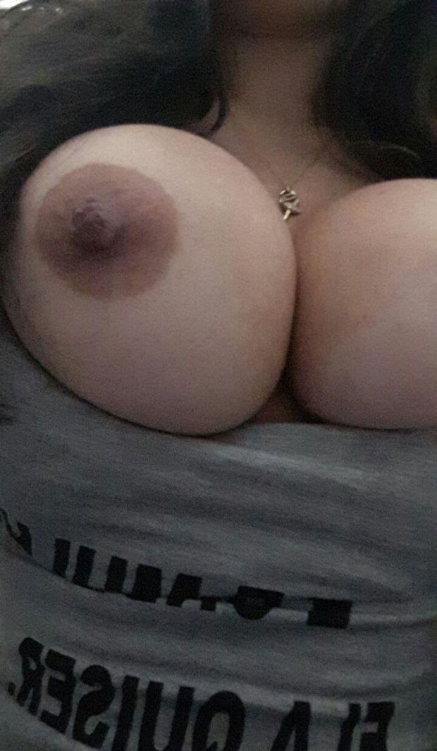 Drunk latino showing breasts at bar
