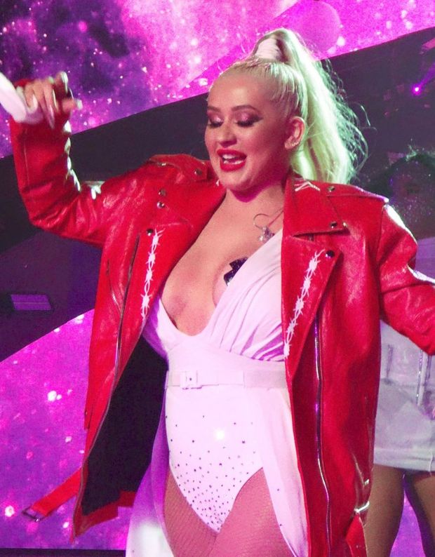 Christina Aguilera nip slip wardrobe malfunction on stage for New Years Eve accidentally flashing her boobs but she was saved by taping her