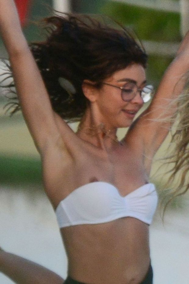 Sarah Hyland nip slip wardrobe malfunction accidentally flashing her nipples in a bikini at the beach in Mexico for New Years Eve seen by pa