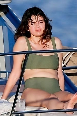 Selena Gomez in a sexy bikini seen by paparazzi out on a yacht in Hawaii.
