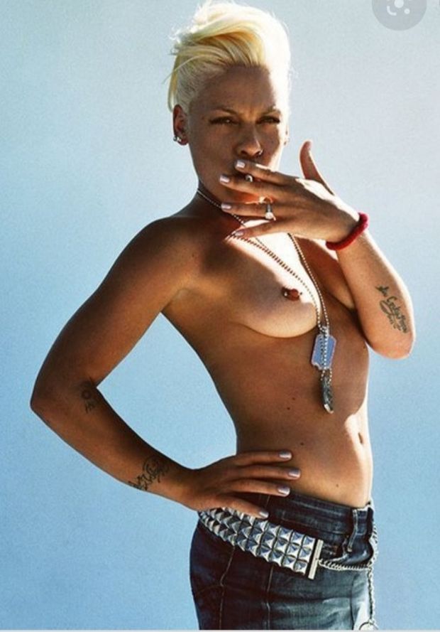 Pink topless having a smoke