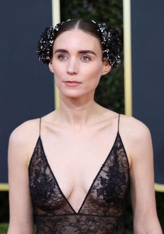 Rooney Mara braless boobs in a see through dress showing off her tits and cleavage photographed arriving to the Golden Globe Awards.