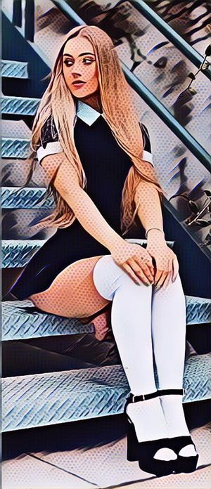 blond shemale dick peeks out of skirt