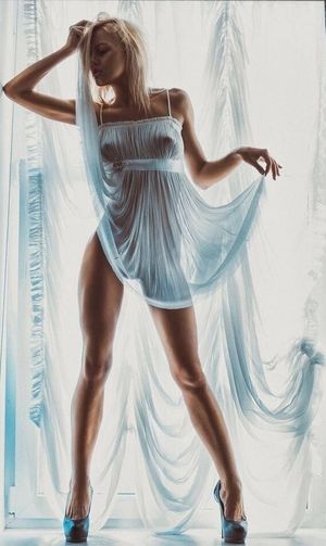 Blonde Beauty in a see though dress and no panties