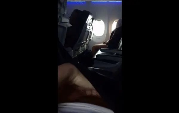 woman shamelessly masturbating in public in an airplane