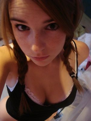 Busty teen with pigtails.