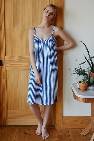 Lovely gal barefoot in over the knee dress