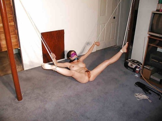 In our basement was a new wife bound and helpless. A first timer to our Super Bowl party, she laid there spread open for the men to use.