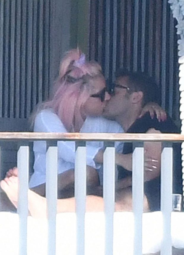 Lady Gaga caught kissing some new guy by paparazzi showing nice cleavage with her braless boobs in a robe and thong.