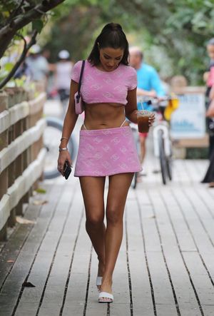 Olivia Culpo sexy ass in a thong bikini also showing nice underboob cleavage with her big tits in a pink outfit on the beach in Miami seen b