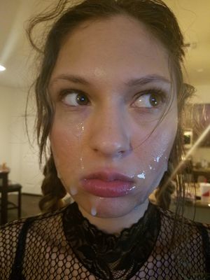 sexy chick has cum all over her face