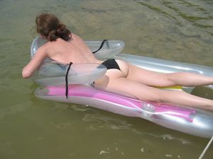 Milf sunbathing on the lake