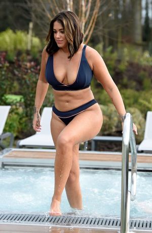 Malin Andersson drinking and relaxing at a spa in a sexy bikini showing off nice cleavage with her big tits seen by paparazzi.