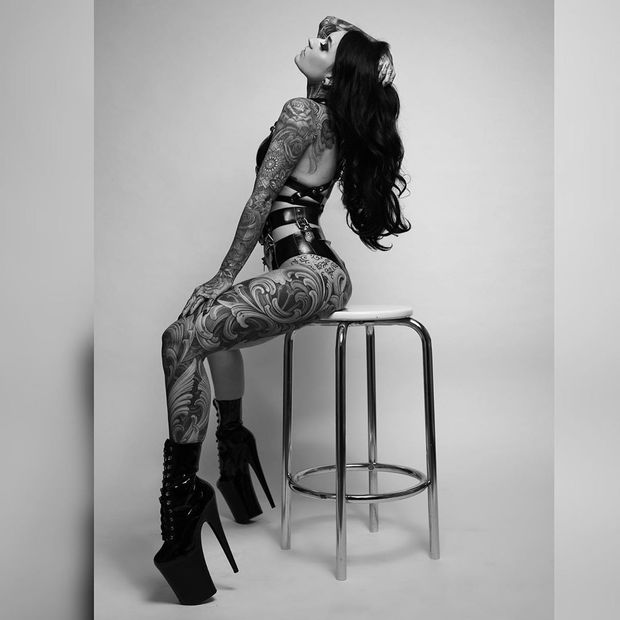 The heels on this tattooed goddess...