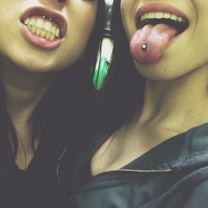 Sexy brunettes showing piercings