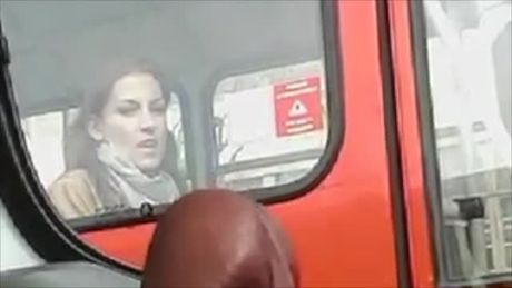 Guy in car plays with dick while having an admirer.