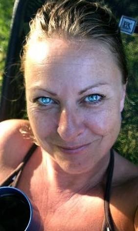 close-up: inviting smiling Hot MILF with intense blue eyes asks for special cream in her coffee. 57a