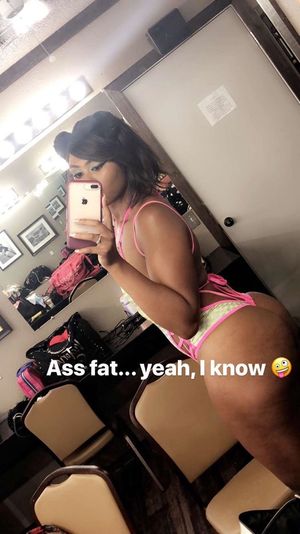 Chocolate woman knows she has a fat ass