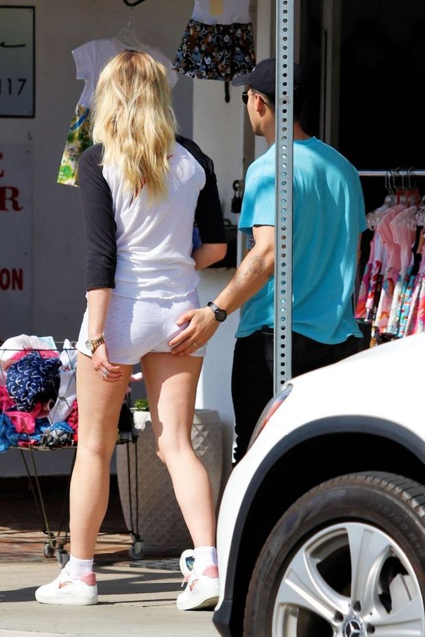 Joe Jonas is seen out with his wife Sophie Turner seen by paparazzi grabbing her ass wearing sexy little shorts.