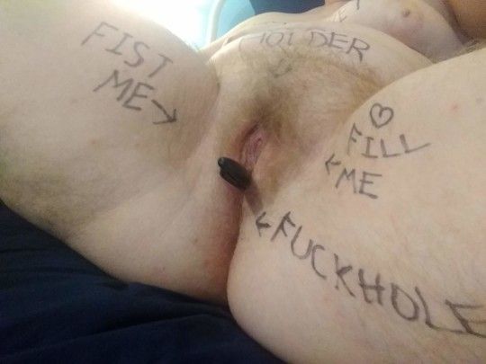 I love writing humiliating words on my body