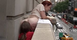 Getting her ass eaten on the balcony
