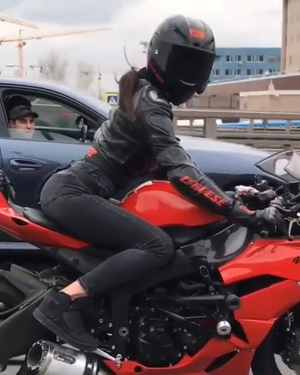sexy biker in traffic