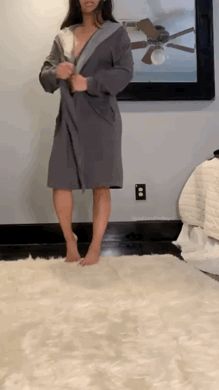 Removing her robe and doing a little spin