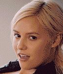 Seductive Blonde Winks and Bites Her Lip