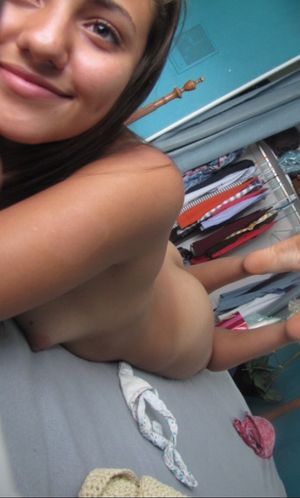 Nice smile, petite tits, and a nice ass