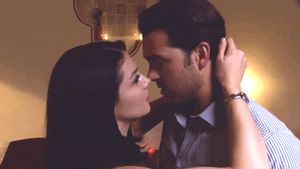 I hate watching her kiss him