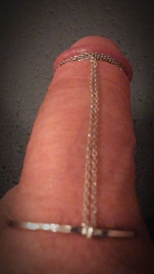 A friend’s necklace decorating my cock