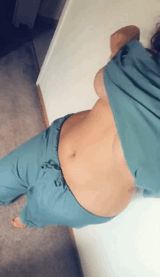 Taking a selfie of herself undressing after her shift