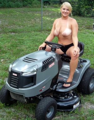 My wife with bare tits mows the grass