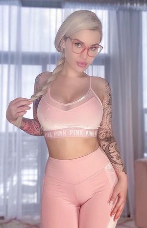 Sexy blonde wearing glasses and yoga pants