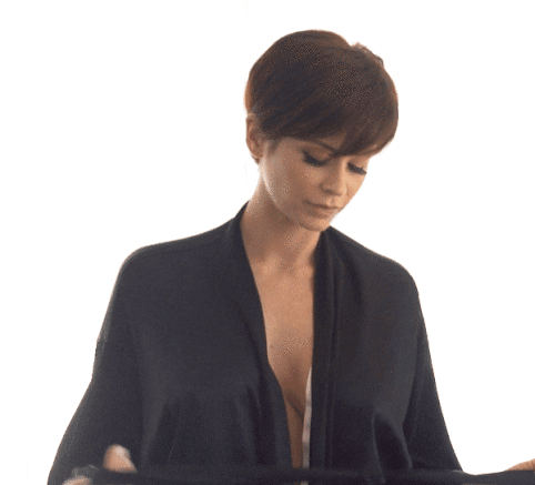 Short haired milf undressing
