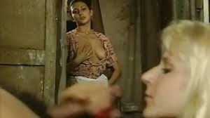 Who is she (the one grabbing her boobs)