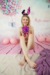 Cute blonde sitting with her legs crossed