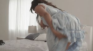 Cassidy Banks lifts her blue dress